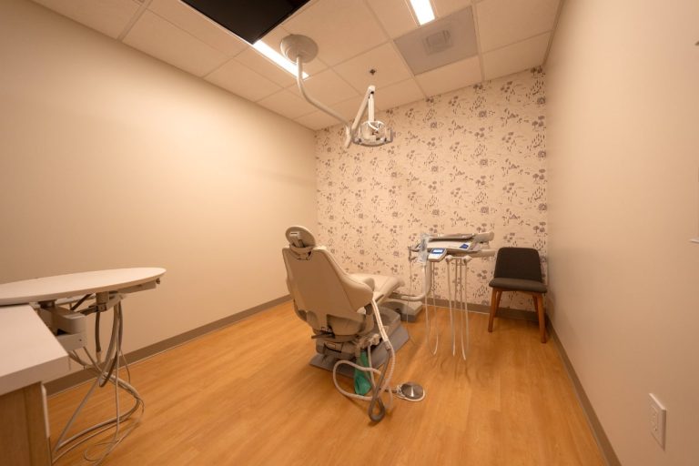Empty dental office with chair and equipment