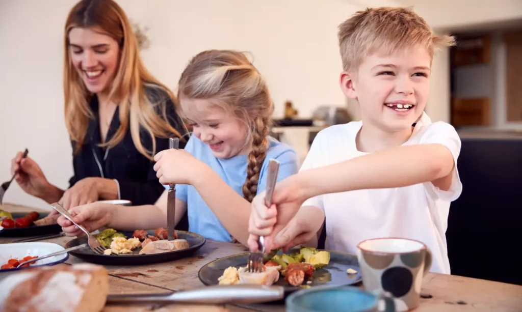 Family enjoying breakfast together at the table.